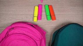 School supplies move into two school bags. Preparation for studyingin family with two children - Powered by Shutterstock - Get 15% off with code: PIKWIZARD15