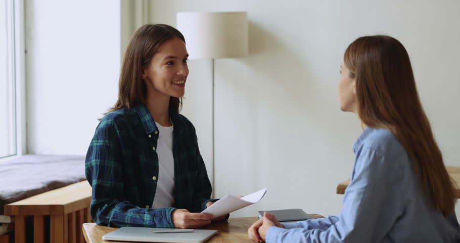 Confident woman company owner, HR manager interviewing new female employee. Businessladies partners discuss terms of contract, conclude agreement, shake hands. Human resources, staffing, negotiations Royalty-Free Stock Footage #1105424339