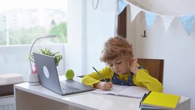 Close up Schoolboy child write exercise alphabet using laptop online educational lesson programming course at home. Distance learning remote video conference. Schoolgirl study does homework.