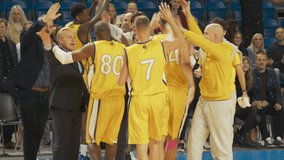 Multiethnic Basketball Players Celebrate Championship Win with Hugs, High Fives and Chest Bumps. Exclusive Joyful Sports Action on Live TV and Pay Per View Internet Broadcast - Powered by Shutterstock - Get 15% off with code: PIKWIZARD15