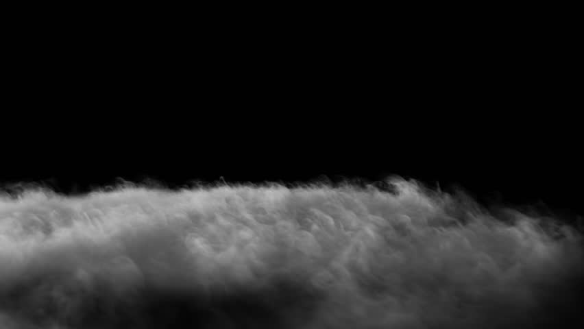 Thick ground fog slowly moving forward - isolated on black background - VFX element - 4K Pro Res