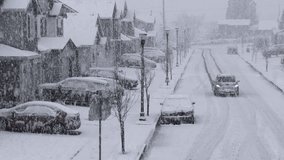 Brave driver drives on icy streets through residential neighborhood during snow storm. - Powered by Shutterstock - Get 15% off with code: PIKWIZARD15