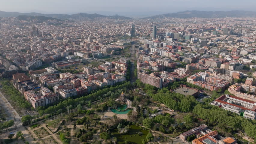 Aerial view of ZOO and Parc de la Ciutadella. Amazing metropolis cityscape at golden hour. Barcelona, Spain