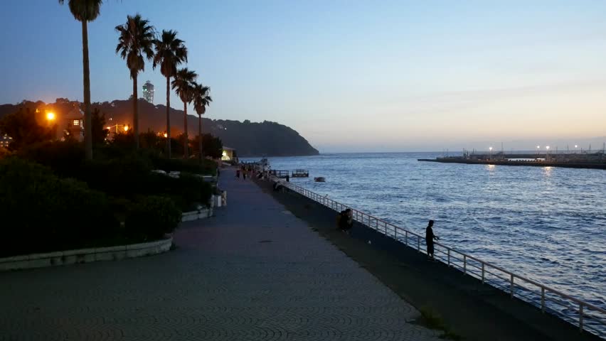 A view of Enoshima Island at dusk from the entrance of the bridge.
