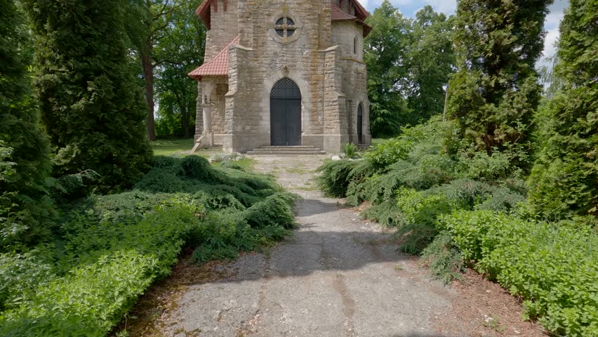 Stone neo-gothic catholic church of St. Anthony of Padua of the end of the 19th century in Losyach village, Ukraine. View of main facade while vertical panning
