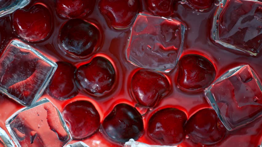 Super Slow Motion Shot of Water Wave Splashing on Cherries and Ice Cubes at 1000fps. Royalty-Free Stock Footage #1105493605