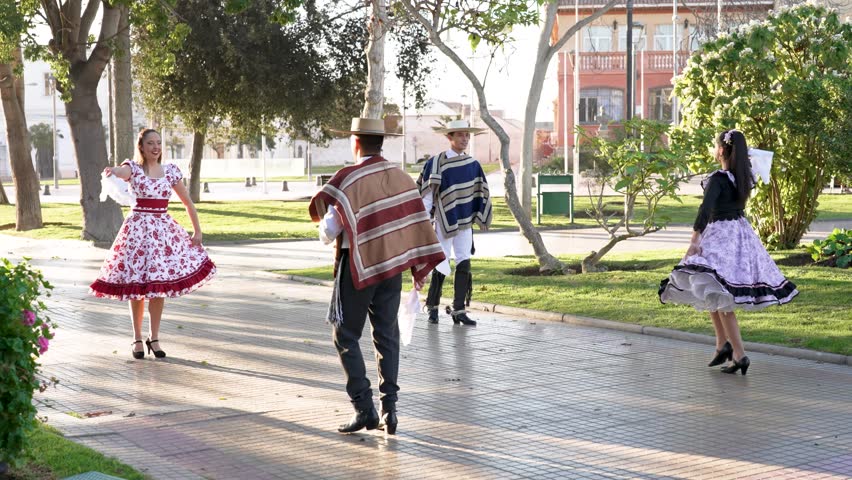 mixed group of four people dressed as huaso dancing cueca in the town square Royalty-Free Stock Footage #1105499469