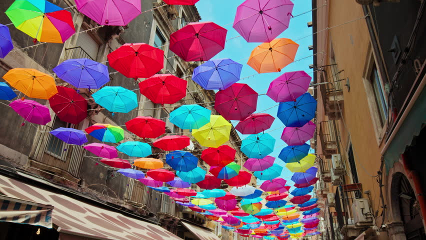 Beautiful streets with decorative colorful umbrellas in Catania, Italy. Amazing streets and buildings in Sicily, Italy in ProRes 4K. Royalty-Free Stock Footage #1105500713