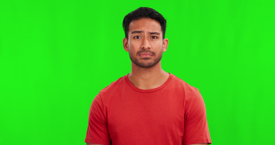 Confused, doubt and question with a man on a green screen background in studio for problem solving or uncertainty. Portrait, why and asking with a young male person looking unsure on chromakey mockup Royalty-Free Stock Footage #1105500945