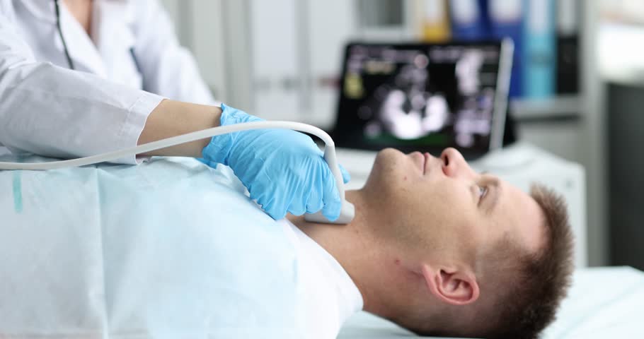 Man examine thyroid gland with ultrasound probe in medical office Royalty-Free Stock Footage #1105504225