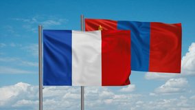 Mongolia and France flag waving together in the wind on blue sky, cycle looped video, two country cooperation concept