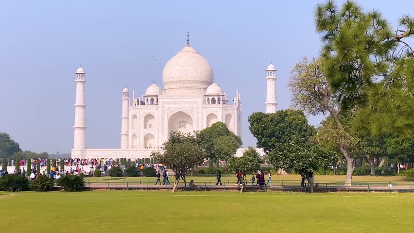 Agra, Uttar Pradesh, India - 12.15.2022: Taj Mahal, Agra, India. Tourists visiting a popular tourist attraction. Royalty-Free Stock Footage #1105508333