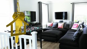 Animation of hanging golden house keys against interior of a modern living room. Interior designing and real estate concept - Powered by Shutterstock - Get 15% off with code: PIKWIZARD15