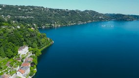 Beautiful panoramic aerial 4K video Lake Orta, Orta San Giulio, Italy, Piedmont. Nature of Italy from a drone. 