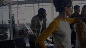 Animation of multicolored infographic interface over diverse coworkers sharing ideas in office. Digital composite, multiple exposure, report, business, teamwork, discussion and global concept. - Powered by Shutterstock - Get 15% off with code: PIKWIZARD15