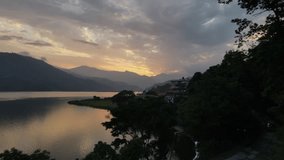 Aerial view of Nepalese nature in Pokhara city. Drone flight overlooking the Nepalese landscape during sunset. 4k footage.