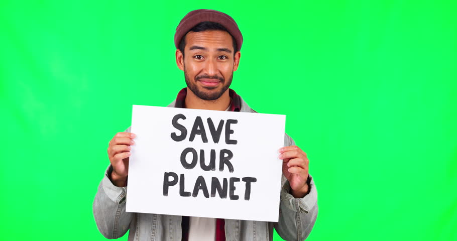 Man, face and protest with billboard by green screen, justice and sustainability in promo in mock up for planet. Young Asian guy, student and volunteer with paper, sign and poster for climate change