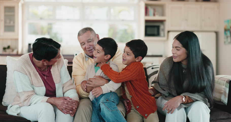 Fun, family smile and living room play with grandparents and children together on a sofa with care. Home, parent love and kids on a lounge couch playing a game feeling happy and support with youth Royalty-Free Stock Footage #1105529123