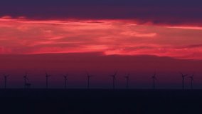 a modern offshore wind farm in the evening 4k 30fps video
