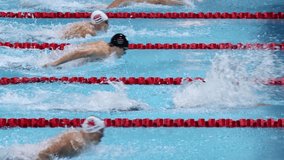 Footage of swimming athletes swimming intensively - Powered by Shutterstock - Get 15% off with code: PIKWIZARD15