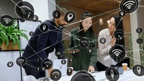 Animation of network of digital icons over diverse businesspeople discussing over a plan at office. Global networking and business technology concept - Powered by Shutterstock - Get 15% off with code: PIKWIZARD15