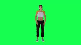 Beautiful lady in yellow white dress black pants and blue shoes closing the box from front angle on green screen
