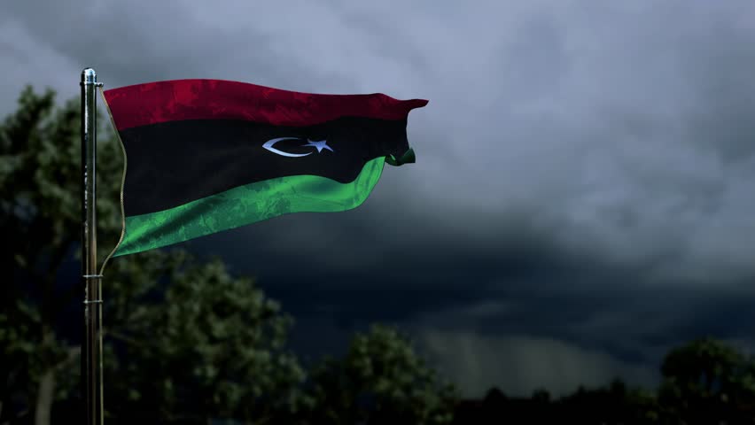 waving Libya flag for memorial day on dark storm cumulus Royalty-Free Stock Footage #1105541521