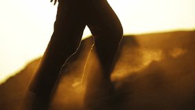 close up video of feet of an adult woman climbing up the sand hill at sunset. person walking barefoot slow motion. beautiful desert video. Sahara, Africa, Gobi - Powered by Shutterstock - Get 15% off with code: PIKWIZARD15