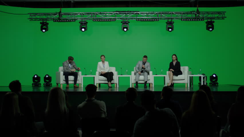 GREEN SCREEN CHROMA KEY Group of 4 experts sitting on stage, answering audience questions during the conference  Royalty-Free Stock Footage #1105546207