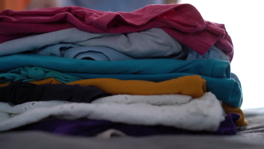 Woman donates her clothes. Sale of used clothes. Donation Royalty-Free Stock Footage #1105548789