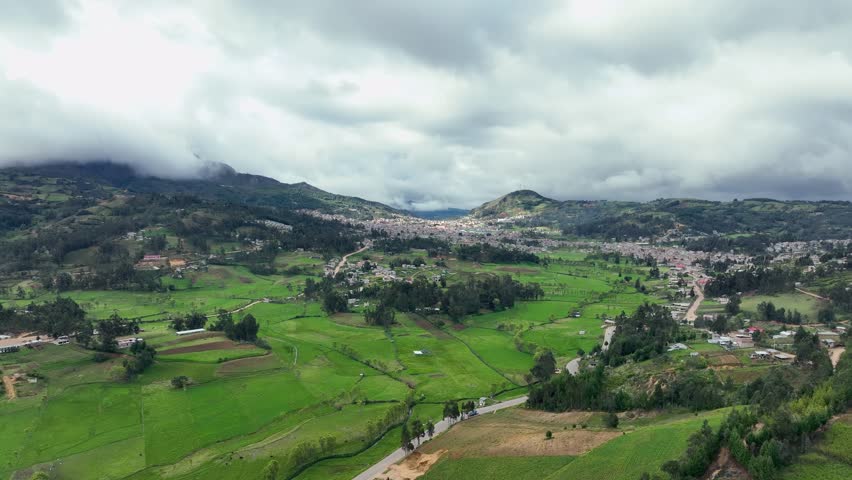 Beautiful aerial view of the field and peruvian andes little city at sunset. City of Cutervo, Cajamarca, Peru.