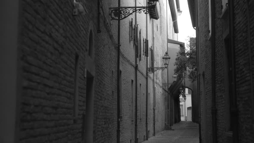 Grayscale Shot Of A Narrow Street On Alleyway At An Old Town Of Forli In Italy