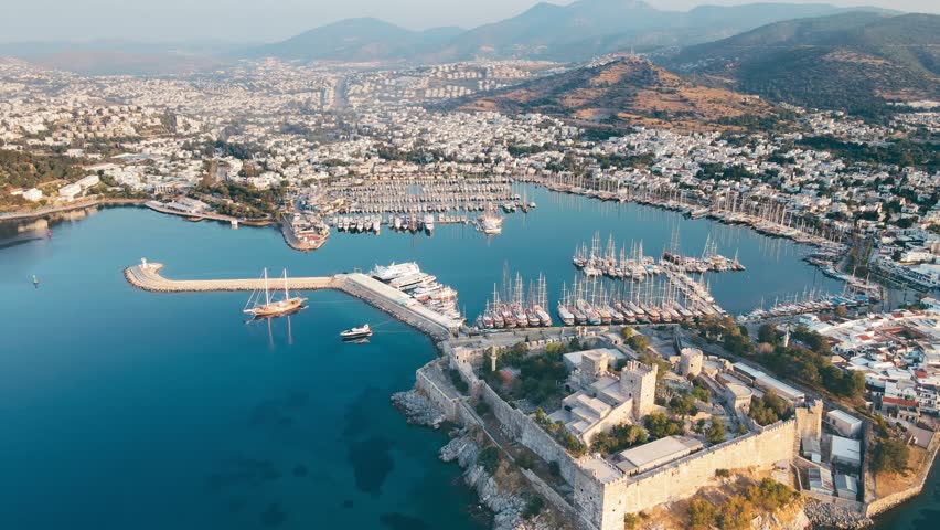 Aerial drone view of Bodrum ancient castle in resort town of Bodrum in Turkey Royalty-Free Stock Footage #1105551977