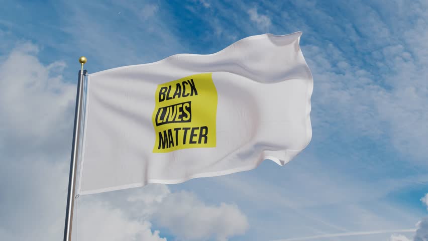 Loop of a flag bearing the iconic logo of Black Lives Matter waving in the wind