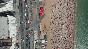 Aerial video of the crowded city beach in summer.