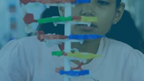 Animation of digital clock over biracial girl rotating and looking at model of dna helix. Digital composite, multiple exposure, childhood, anatomy, molecule, medical, technology and education. - Powered by Shutterstock - Get 15% off with code: PIKWIZARD15