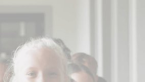 Animation of multicolored connected puzzle pieces over happy diverse children in background. Digital composite, multiple exposure, jigsaw, childhood, autism and togetherness concept. - Powered by Shutterstock - Get 15% off with code: PIKWIZARD15