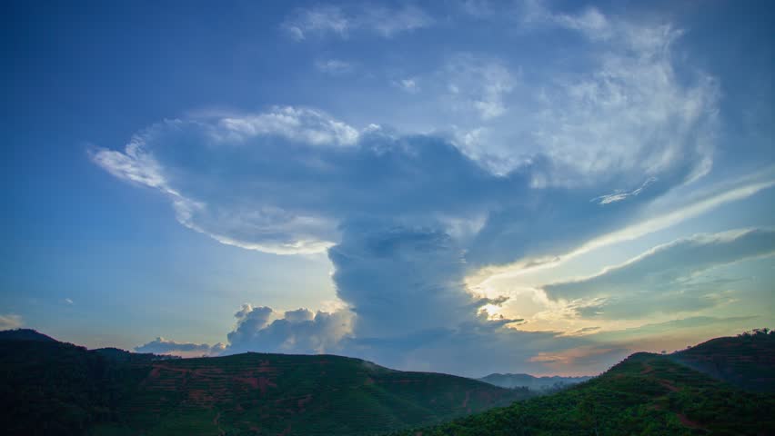 Timelapse Clouds Forming a Whirlwind in stunning sunset.
The sky was dark, and in the distance, the clouds began to spin together, 
creating a powerful whirlwind that filled the air with strong winds. Royalty-Free Stock Footage #1105563547