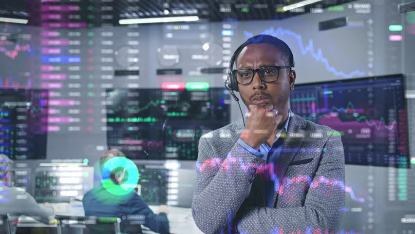 African American financial analyst works in broker agency office. 3D abstract AI animation of real-time stocks and cryptocurrency charts on glass wall. Computers and big digital screens on background. Royalty-Free Stock Footage #1105565351