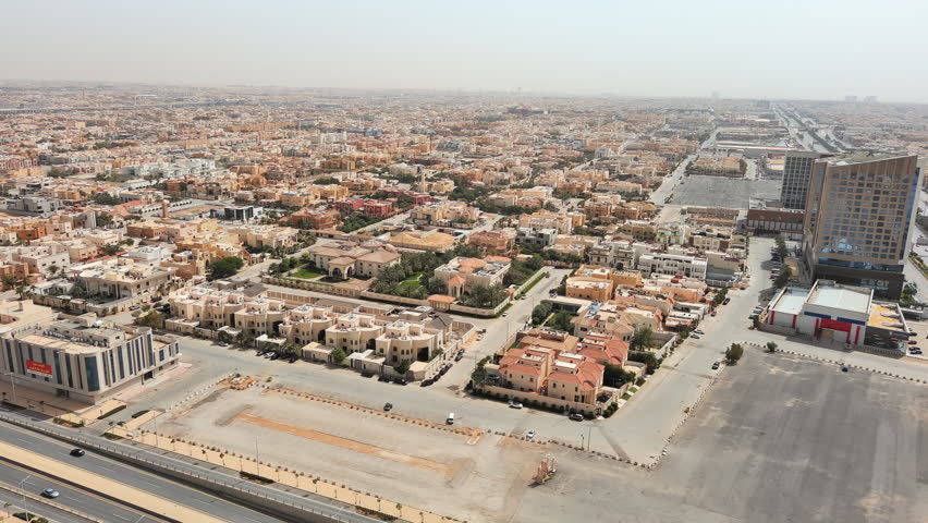 Riyadh: Aerial view of capital city of Saudi Arabia, low-rise residential buildings in Arabic style - landscape panorama of Arabian Peninsula from above Royalty-Free Stock Footage #1105568505