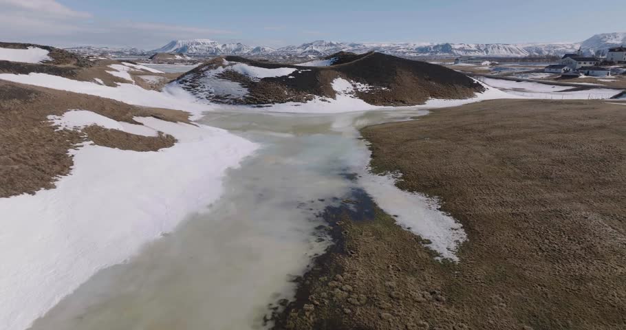 Mývatn Lake, Iceland. Drone Shot of Frozen Water and Volcanic Craters on Sunny Winter Day, 50fps