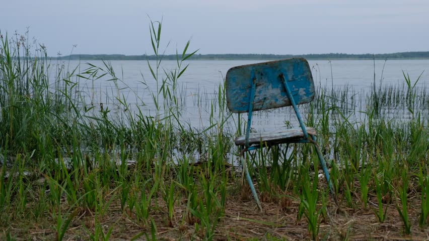 Meditation place. Old chair on the shore of Lake Svitiaz. Shatsky national nature park. Ukraine. 