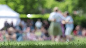 People during a dance party in the park, blurred silhouettes. from a low angle - Powered by Shutterstock - Get 15% off with code: PIKWIZARD15