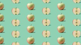 Stop motion Cut and whole Apple appear and disappear on pastel green background. High quality video 4K. Detailed stop motion video. Background or wallpaper in food and drinks videos.