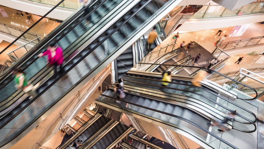 Timelapse of Asian people customer transport on escalator at urban shopping mall in Hong Kong. Department store business, financial economy, Asia city life, tourist traveler lifestyle. High angle view Royalty-Free Stock Footage #1105575899