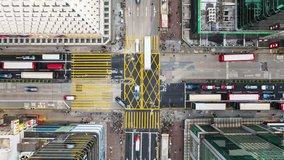 Hyperlapse Timelapse of car traffic transport on road junction intersection in Mong Kok, Hong Kong city downtown. Drone aerial top view. Asian people lifestyle, Asia city life or public transportation - Powered by Shutterstock - Get 15% off with code: PIKWIZARD15