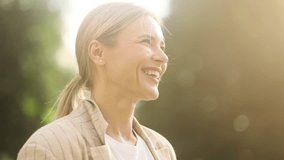 Portrait of confident mature blond woman looking ahead and exhaling fresh air taking deep breath and reducing stress after work at park Successful businesswoman resting for peaceful mind outdoors - Powered by Shutterstock - Get 15% off with code: PIKWIZARD15