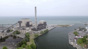 Power generating plant along Lake, Michigan in Michigan City, Indiana with drone video moving sideways.