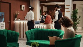 Company executives upgrading holiday package deal, writing digital signature on tablet. Professional work partners on business trip upscaling hotel room amenities, helped by helpful receptionist - Powered by Shutterstock - Get 15% off with code: PIKWIZARD15