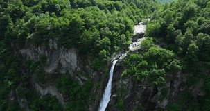 Foroglio waterfall in Switzerland. Aerial backward 